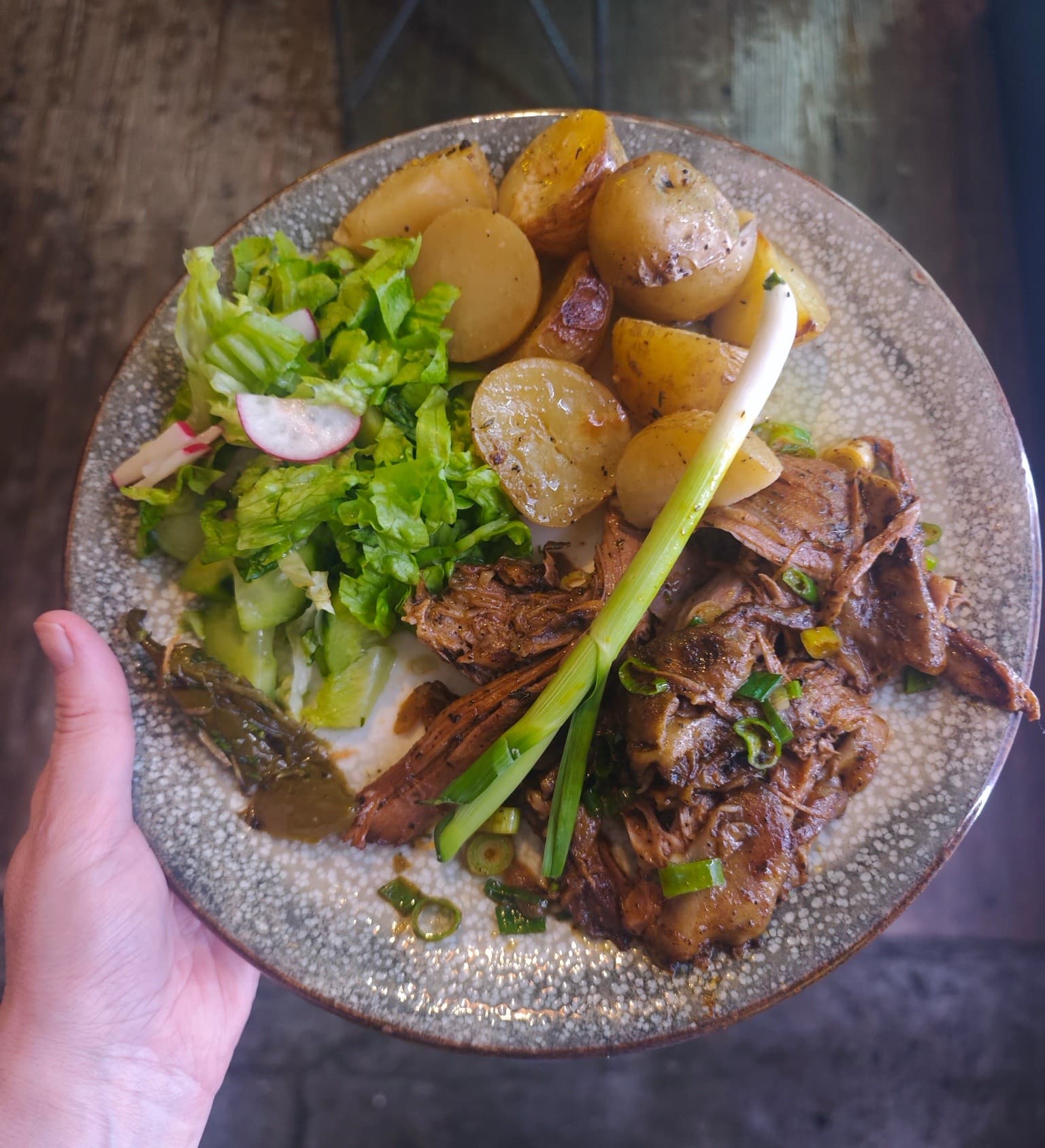 Signature slow-roasted lamb with baby potatoes at The Friendly Bear Sofia
